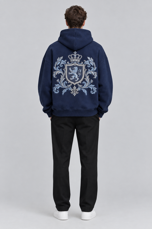 Model wearing the SAUVRIM Blue Browl hoodie, back view with the crest embroidery