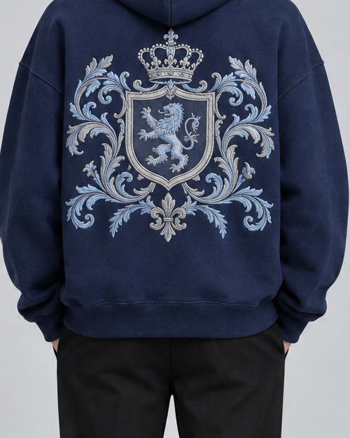 Close view of the crest embroidery on the SAUVRIM Blue Browl hoodie