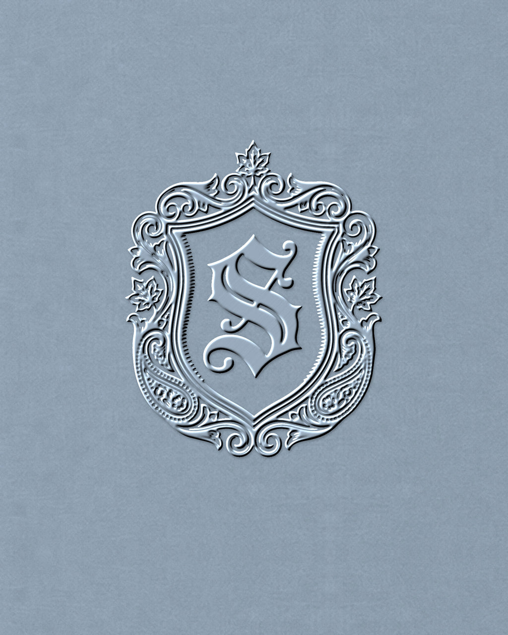Close-up of the tonal SAUVRIM crest embroidered on the chest