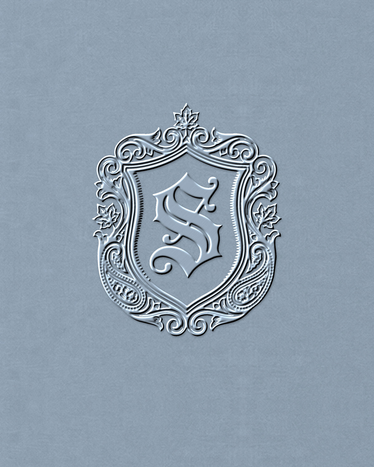 Close-up of the tonal SAUVRIM crest embroidered on the chest