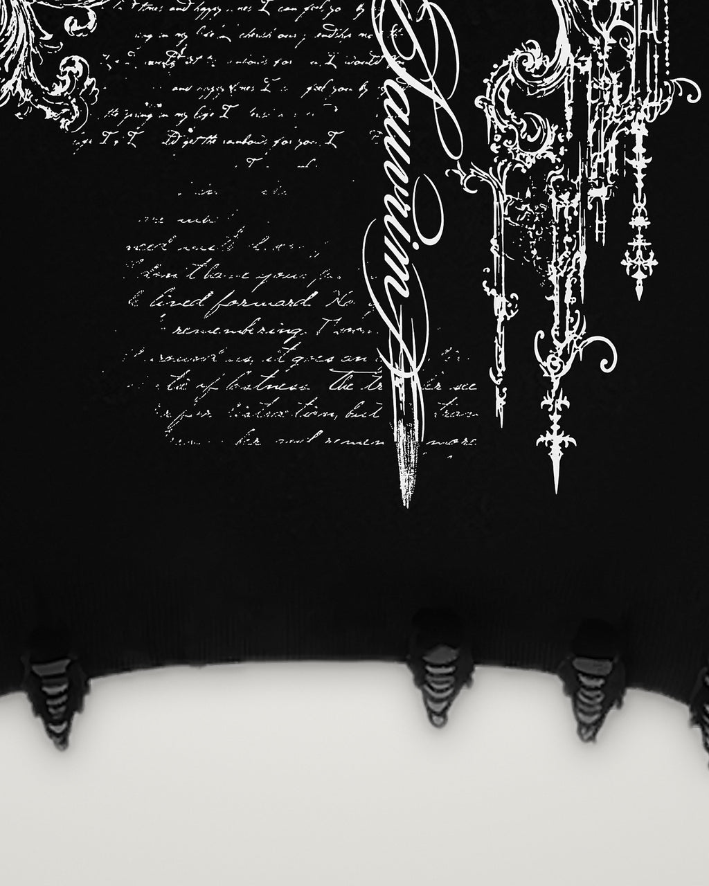 Ripped rib hem and the lower back print of the Sword & Script hoodie
